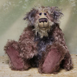 Priscilla Proon sitting. Priscilla Proon is a calm and thoughtful beautifully coloured one of a kind artist bear in gorgeous rose and grey hand dyed mohair by Barbara Ann Bears she stands 12 inches( 30cm) tall