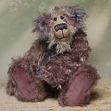 Priscilla Proon sitting. Priscilla Proon is a calm and thoughtful beautifully coloured one of a kind artist bear in gorgeous rose and grey hand dyed mohair by Barbara Ann Bears she stands 12 inches( 30cm) tall