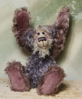 Priscilla Proon sitting with her hands in the air. Priscilla Proon is a calm and thoughtful beautifully coloured one of a kind artist bear in gorgeous rose and grey hand dyed mohair by Barbara Ann Bears she stands 12 inches( 30cm) tall