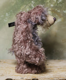 Priscilla Proon standing viewed in profile. Priscilla Proon is a calm and thoughtful beautifully coloured one of a kind artist bear in gorgeous rose and grey hand dyed mohair by Barbara Ann Bears she stands 12 inches( 30cm) tall