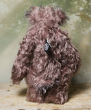 Priscilla Proon standing viewed from behind. Priscilla Proon is a calm and thoughtful beautifully coloured one of a kind artist bear in gorgeous rose and grey hand dyed mohair by Barbara Ann Bears she stands 12 inches( 30cm) tall