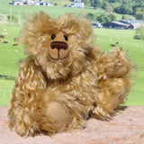 Robbie McFluff is a cute and quite little one of a kind artist bear in wildly curly mohair by Barbara-Ann Bears, he stands just 7 inches(18 cm) tall and is 5.5 inches (14 cm) sitting. Robbie is made from wonderful, wildly curly beige gold mohair, with a slightly warmer backcloth and he has beige German wool felt paw pads 