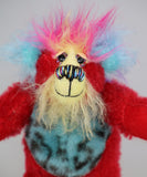 Rudi Ruffles is a very happy little teddy bear, a one of a kind, mohair and faux fur artist bear by Barbara-Ann Bears, is quite a little bear, he stands just 5.5 inches/14 cm tall. He is made from a short red German mohair, with hand dyed yellow and blue mohair and soft sky blue faux fur with black Jaguar-like rosettes