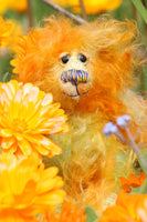 Rudyard Edgar Bloom Sniffer is a sweet and beautifully coloured one of a kind teddy bear in hand dyed mohair by Barbara-Ann Bears, he stands just 6.5 inches/16 cm tall. He is made from a fairly a long tousled mohair hand-dyed in orange, gold, pale green, amber and blue. He has hand dyed paw pads, hand painted eyes and a sweet little embroidered nose and a sweet smile.