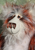 Rusty McBruin is a very shaggy, wild and wonderful, one of a kind, artist teddy bear by Barbara-Ann Bears. He's made from luxurious long white mohair and gorgeous long, shaggy and dense faux fur which is black at the base with copper and white tipping. Rusty McBruin is a large and heavy teddy bear, he stands 18 inches (46 cm) tall 