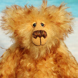 Rutherford is a sweet and very friendly, one of a kind, artist teddy bear in beautiful tipped mohair by Barbara-Ann Bears

Rutherford is made from long, dense, brown tipped gold mohair. He has beautiful hand painted, twinkling, glass eyes with hand coloured eyelids, a splendid nose embroidered from individual threads and a happy, hopeful expression