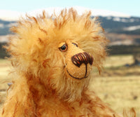 Rutherford is made from long, dense, brown tipped gold mohair. He has beautiful hand painted, twinkling, glass eyes with hand coloured eyelids, a splendid nose embroidered from individual threads and a happy, hopeful expression