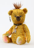 Scuggs is an endearingly sweet and gently wild beautifully coloured one of a kind, mohair artist bear by Barbara-Ann Bears, he stands 13 inches/33 cm tall and is 10.5 inches/26 cm sitting. He is made from gold mohair which has a dark brown backcloth, with a mohawk, hand dyed paw pads, and hand painted eyes with eyelids