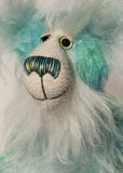 He is made from mohair hand dyed in shades of blue, green, turquoise and lime, His face, the fronts of his ears and the underside of his tail are made from a long, fluffy white faux fur and he has hand dyed velvet paws Sebastian Swoon has beautiful, hand painted eyes with hand coloured eyelids, a splendid nose embroidered from individual threads to complement his colouring and he has a sweet, friendly smile