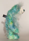Sebastian Swoon is an elegant and beautifully coloured one of a kind, hand dyed mohair artist bear by Barbara-Ann Bears, he stands 14 inches/36 cm tall and is 10.5 inches/26 cm sitting.He is made from mohair hand dyed in shades of blue, green, turquoise and lime, His face, the fronts of his ears and the underside of his tail are made from a long, fluffy white faux fur and he has hand dyed velvet paws