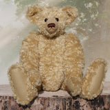 Sir Galahad is a very large, elegant and huggable, one of a kind, classical mohair artist teddy bear made by Barbara-Ann Bears Sir Galahad stands 24.5 inches/62 cm tall and is made from dense and wavy, golden German mohair with beige wool felt paw pads, large black boot button eyes, an impressive brown nose and the sweetest smile. 