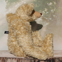 Sir Galahad is a very large, elegant and huggable, one of a kind, classical mohair artist teddy bear made by Barbara-Ann Bears Sir Galahad stands 24.5 inches/62 cm tall and is made from dense and wavy, golden German mohair with beige wool felt paw pads, large black boot button eyes, an impressive brown nose and the sweetest smile. 