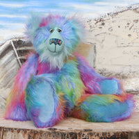 Syracuse sitting.
Syracuse is a large and beautifully coloured one of a kind artist bear by Barbara Ann Bears in luxurious multi-coloured fluffy faux fur and very long, turquoise mohair he stands 19 inches/48 cm tall