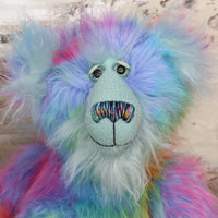 Syracuse's face. showing his beautiful hand painted eyes (with eyelids), wonderfully embroidered nose and sweet smile.
Syracuse is a large and beautifully coloured one of a kind artist bear by Barbara Ann Bears in luxurious multi-coloured fluffy faux fur and very long, turquoise mohair he stands 19 inches/48 cm tall