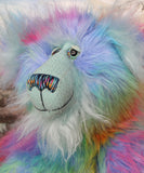 Syracuse's face. showing his beautiful hand painted eyes (with eyelids), wonderfully embroidered nose and sweet smile.
Syracuse is a large and beautifully coloured one of a kind artist bear by Barbara Ann Bears in luxurious multi-coloured fluffy faux fur and very long, turquoise mohair he stands 19 inches/48 cm tall