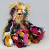Syracuse sitting, Syracuse is a 19 inch one of a kind, artist bear by Barbara-Ann Bears in luxurious blonde mohair and beautifully colourful faux fur