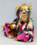Syracuse sitting, Syracuse is a 19 inch one of a kind, artist bear by Barbara-Ann Bears in luxurious blonde mohair and beautifully colourful faux fur