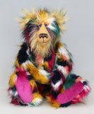 Syracuse sitting, Syracuse is a 19 inch one of a kind, artist bear by Barbara-Ann Bears in luxurious blonde mohair and beautifully colourful faux fur