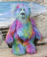 Syracuse standing.
Syracuse is a large and beautifully coloured one of a kind artist bear by Barbara Ann Bears in luxurious multi-coloured fluffy faux fur and very long, turquoise mohair he stands 19 inches/48 cm tall