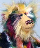 Syracuse's face showing his fluffy blonde beard, his hand painted glass eyes, multi coloured nose and sweet smile. Syracuse is a 19 inch one of a kind, artist bear by Barbara-Ann Bears in luxurious blonde mohair and beautifully colourful faux fur