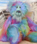 Syracuse sitting.
Syracuse is a large and beautifully coloured one of a kind artist bear by Barbara Ann Bears in luxurious multi-coloured fluffy faux fur and very long, turquoise mohair he stands 19 inches/48 cm tall