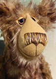 Wilbur has beautiful hand painted eyes, intricately embroidered nose and a huge smile, this is a close up of his face 