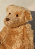 Wilfred is a very sweet and friendly artist teddy bear in gorgeous mohair by Barbara Ann Bears, he is 12 inches/30 cm tall and is 8.5 inches/21 cm sitting. Wilfred is made from a wonderful antique gold mohair with brown wool felt paw pads and gorgeous amber glass eyes. Wilfred has a carefully embroidered brown nose