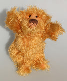 Plush teddy bear with a fluffy texture on a plain background