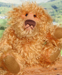 Plush teddy bear with a blurred natural background