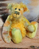 Alexander Appleshine is a sweet and gently colourful one of a kind, artist bear in gorgeous hand dyed mohair by Barbara-Ann Bears, he stands 11.5 inches( 29cm) tall and is 9 inches ( 23 cm) sitting. He's mostly made from a short, straight pile mohair hand dyed in shades of lime, jade, deep peach and lilac.