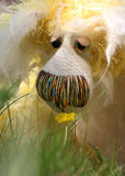 Alfredo Buttercup, a comical yet elegant yellow and white, one of a kind artist teddy bear in stunning hand dyed mohair by Barbara-Ann Bears. Alfredo Buttercup stands 17 inches (43 cm) tall and is 13 inches (33 cm) sitting. He is mostly made from a long and straggly mohair hand-dyed in sunny shades of yellow and gold.