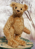 Ambrose is a charming, traditional one of a kind artist bear in German mohair by Barbara Ann Bears, he stands 10 inches/27 cm tall and is 7.5 inches/22 cm sitting. Ambrose is made from beautiful, slightly wavy, warm antique gold German mohair with fawn ultrasuede paw pads and vintage boot buttons for eyes 
