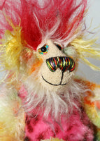 Basil is made from a short, straight mohair hand dyed in yellow, green, lime, orange, red and blue. His tummy is pink faux fur with black rosettes, his face is a long white mohair with blue tips, the top of his head is a long red mohair and the fronts of his ears and the underside of his tail are a long mohair hand dyed bright yellow. Basil has hand dyed velvet paw pads. Basil has hand painted eyes with eyelids, a splendid nose embroidered from individual coloured threads and he has a huge smile
