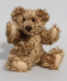 Bernard McFluff is a very old bear, he was one of our first designs going back to 1992. He is 12 inches/30cm tall and is 9 inches/23cm sitting Bernard McFluff is made from a beautiful, distressed, shaggy, soft brown English mohair, he was one of our first bears with a long snout and a big tummy