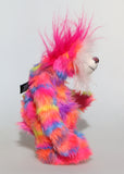 Bing-Bong is a colourful, fun-loving and comical, one of a kind, artist bear by Barbara-Ann Bears in luxurious mohair and rather wild faux fur, he stands 13 inches (33 cm) tall and is 10.5 inches (27 cm) sitting. He is mostly made from a multicoloured faux fur, it has patches of magenta, orange, yellow, blue and violet