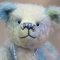 Bluey is made from a fairly short and sparse German mohair which Barbara has hand-dyed in natural blues, there are muted shades of aqua, jade, lilac and turquoise . Bluey has coordinating velvet paw pads which were hand-dyed with his mohair.  Bluey has glass eyes which were painted to match his mohair, a cute little nose carefully embroidered with individual threads to also match his colouring and a content and appealing expression.