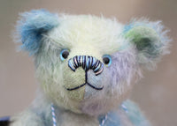 Bluey is made from a fairly short and sparse German mohair which Barbara has hand-dyed in natural blues, there are muted shades of aqua, jade, lilac and turquoise . Bluey has coordinating velvet paw pads which were hand-dyed with his mohair.  Bluey has glass eyes which were painted to match his mohair, a cute little nose carefully embroidered with individual threads to also match his colouring and a content and appealing expression.