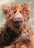 Boris has beautiful hand painted slightly sparkling glass eyes (they were painted to match his mohair) with hand-coloured eyelids, an impressive and wonderfully embroidered nose, sewn from individual threads to match his mohair and an engaging smile.