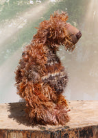 Boris Stroganov is a wild yet friendly, one of a kind, artist bear by Barbara-Ann Bears, he stands 19 inches(48 cm) tall and is 15 inches(38 cm) sitting.  He is made from long, wild and shaggy mohair that Barbara has hand-dyed in many beautiful hues of brown this is complemented by his long and very fluffy faux fur 