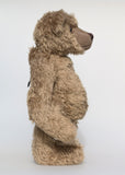Bosworth is a solid and distinguished one of a kind, traditional, mohair artist teddy bear by Barbara Ann Bears, he stands 17 inches (43cm) tall and is 12 inches (31cm) sitting and made from fairly long, slightly wavy greyish-brown brown mohair with a hint of green, he has beige wool felt paw pads and hand painted eyes