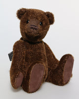 Bruno is a gorgeous little one of a kind traditional teddy bear made from beautiful rich brown mohair by Barbara Ann Bears He is made from a fairly short and sparse, straight pile, almost tufty, deep brown German mohair, he has matching brown, German wool-felt paw pads and antique black boot buttons for eyes
