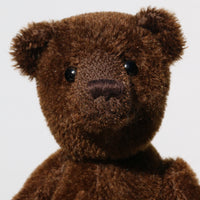 Bruno is a gorgeous little one of a kind traditional teddy bear made from beautiful rich brown mohair by Barbara Ann Bears. Bruno has antique black boot buttons for eyes, a perky little brown nose carefully and a sweet expression that seems both sad and hopeful, like a puppy. 