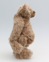 Buster is a very sweet and friendly, quite traditional, one of a kind, mohair artist teddy bear by Barbara Ann Bears, he stands 10 inches/25 cm tall and is 7.5 inches/19 cm sitting. Buster is made from beautiful, quite sparse, fairly straight, soft beige mohair, with German wool-felt paw pads and spherical, glass eyes