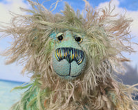 Byron is a wild thing, yet a very friendly wild thing, a one of a kind, hand dyed mohair artist bear by Barbara-Ann Bears, he stands 10.5 inches (26 cm) tall and is 8 inches (20 cm) sitting. He is made from a gorgeous, long, straggly mohair that Barbara has dyed in jade, turquoise with some green, amber and sky blue
