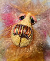 Cameron Chortles is a very happy teddy bear,he is quite colourful in a subdued way, a one of a kind, mohair artist bear by Barbara-Ann Bears Cameron Chortles is quite a little bear, he stands just 7 inches( 17 cm) tall and is 5 inches ( 13 cm) sitting, these measurements don't include his very fluffy ears which add another 2.5 inches (6cm).