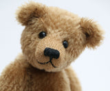 Cecil is a gorgeous little one of a kind traditional teddy bear made from beautiful antique gold mohair by Barbara Ann Bears. Cecil is 8 inches (20cm) tall and is 6 inches (15cm) sitting.