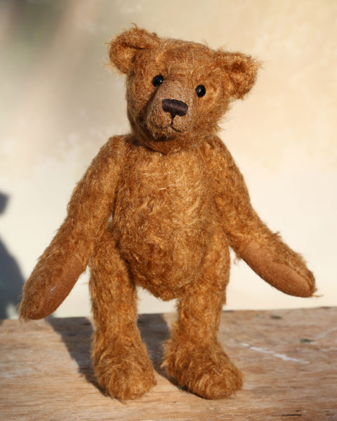 Charleston is a charming, traditional one of a kind artist bear in German mohair by Barbara Ann Bears, he stands 10 inches/27 cm tall and is 7.5 inches/22 cm sitting. Ambrose is made from wildly distressed, 'proper brown' German mohair, he has matching brown, wool-felt paw pads and vintage boot buttons for eyes
