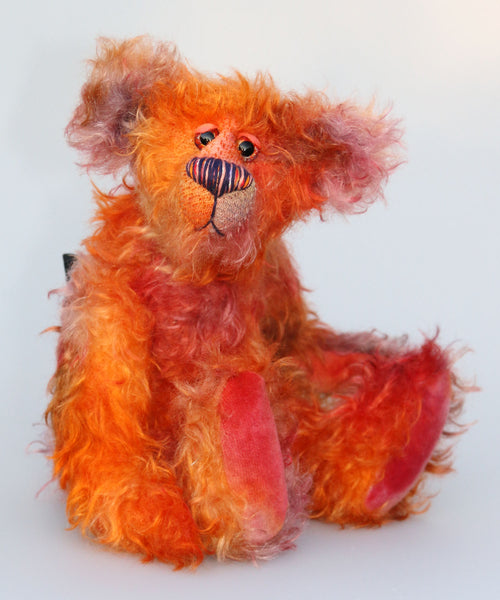 Chipotle is a wild and fiery, yet still very friendly, one of a kind artist bear in beautiful hand dyed mohair by Barbara-Ann Bears Chipotle stands 11 inches(28 cm) tall and is 8 inches (21 cm) sitting. Chipotle is a wild and shaggy chap, a bear who loves to walk across the hottest deserts, to be alone under the fiercest sun