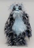 Clarence Clearwater is a magnificent, cuddly one of a kind, artist teddy bear in fabulous faux fur and gorgeous mohair by Barbara-Ann Bears, he stands 19 inches (48 cm) tall and is 14 inches (36 cm) sitting. Clarence is mostly made from a very long, exciting faux fur, mainly black with flashes of silver and grey