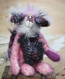 Clarissa The Candyfloss Mountain Dragon a wild yet calm and feminine fluffy pink dragon in gorgeous mohair and faux fur by Barbara Ann Bears, she stands 15 inches( 38 cm) tall and is 11.5 inches (29 cm) sitting. She is about 20 inches (50cm) from nose to tail and has a wingspan of 16 inches (40cm).